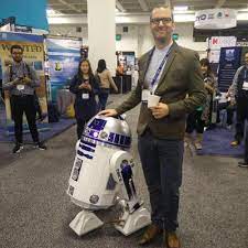 Dave Topping with a robot.